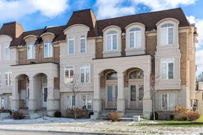 a large brick house with a brown roof at Modern 4 Level home-Game room/Parking/Near Airport in Mississauga