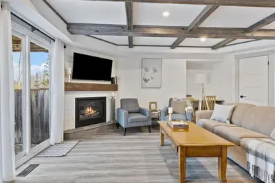 a living room with a couch and a fireplace at Four Peaks - Unit 40A in Collingwood