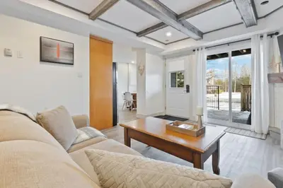 a living room with a couch and a table at Four Peaks - Unit 40A in Collingwood