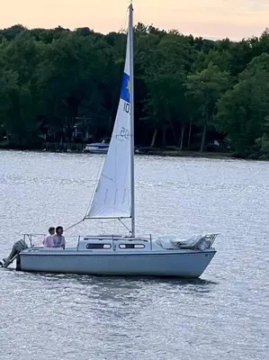 two people on a sail boat in the water at Marmora Hideaway - Lake front in Marmora