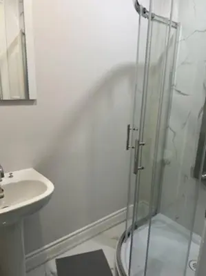 a bathroom with a shower and a sink at Marmora Hideaway - Lake front in Marmora