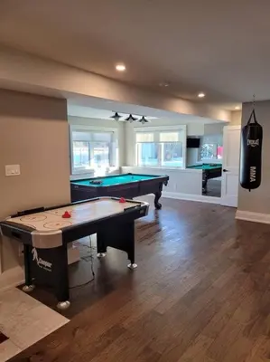 a living room with a pool table in it at Chemong Lake Waterfront Cottage☆privateboatlaunch in Lakefield