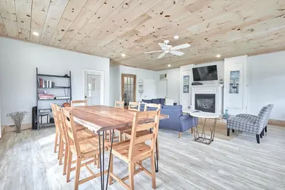 a dining room and living room with a wooden ceiling at Muskoka Honey Harbour 4-Bed Retreat with Hot Tub in Honey Harbor