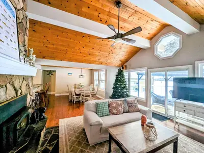 a living room with a couch and a fireplace at Cozy Escape, Kawarthas Cottage With Sauna in Buckhorn