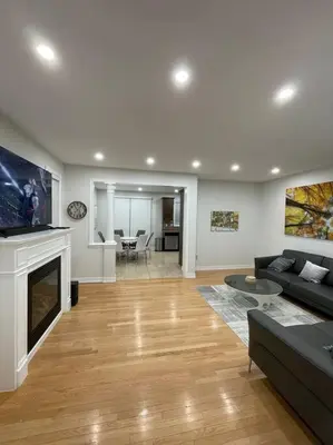 a living room with a couch and a fireplace at Luxury 4-Bedrooms Home… in Brampton