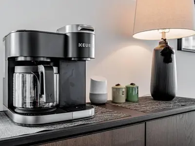 a coffee maker sitting on a counter with a lamp at Luxury Condo on Bay Street in Toronto