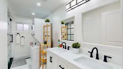 a white bathroom with a sink and a mirror at 3-Bed 3-Bath Cozy Vacation House in Ajax, Greater Toronto Area, ON, Canada in Ajax