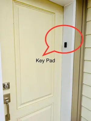 a door with a key pad written on it at Cozy 3-bedroom farmhouse in wine-country in Niagara on the Lake