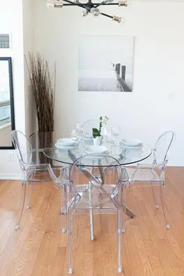 a glass dining table and chairs in a room at Beautiful Modern Toronto Luxurious Scotiabank Arena in Toronto