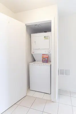 a small refrigerator in a kitchen with its door open at Beautiful Modern Toronto Luxurious Scotiabank Arena in Toronto