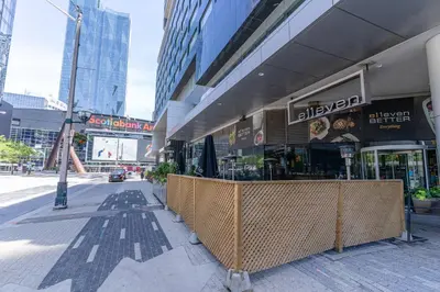 a restaurant on the side of a city street at Beautiful Modern Toronto Luxurious Scotiabank Arena in Toronto
