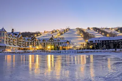 a resort in the snow with a lake and buildings at Condo 208 At North Creek Resort in Blue Mountains