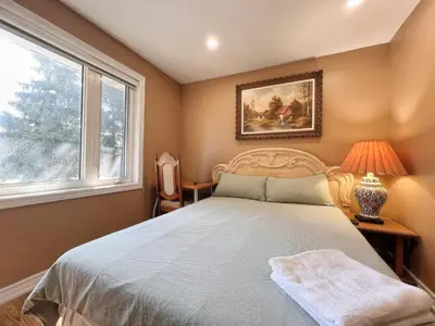 a bedroom with a bed and a window at Spacious Rooms with Bath Near Wonderland & Vaughan Mills Mall in Vaughan