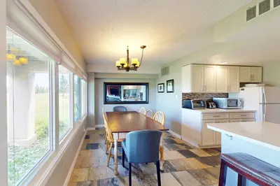 a kitchen with a dining room table and chairs at Wintergreen 125 in Blue Mountains