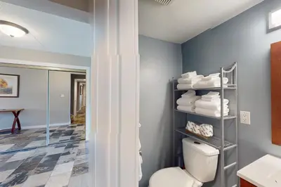 a bathroom with a toilet and a mirror at Wintergreen 125 in Blue Mountains