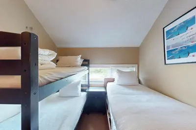 a room with two bunk beds and a window at Wintergreen 125 in Blue Mountains