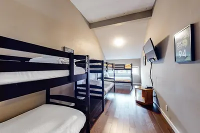 a room with a bunch of bunk beds at Wintergreen 116 in Blue Mountains