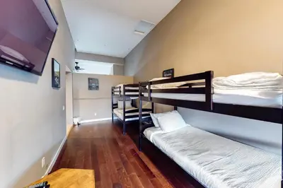 a room with three bunk beds in a room at Wintergreen 116 in Blue Mountains