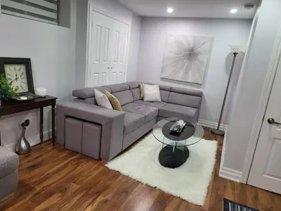 a living room with a couch and a table at Luxurious 1BR-1BA Apartment Bright Spacious with free parking-gc-1 in Brampton
