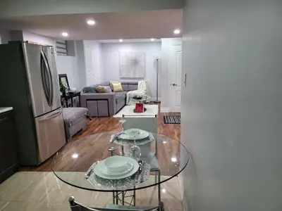 a kitchen and living room with a glass table at Luxurious 1BR-1BA Apartment Bright Spacious with free parking-gc-1 in Brampton