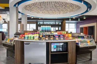 a food counter in a store with drinks on it at Tru By Hilton Toronto Airport West in Mississauga