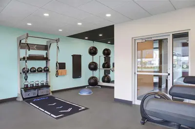 a room with a gym with pots and pans at Tru By Hilton Toronto Airport West in Mississauga