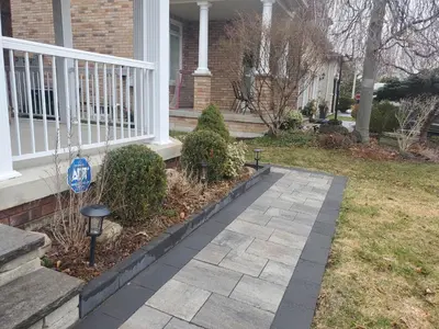 a house with a walkway in front of a yard at Cozy & Convenient Studio Apartment in Pickering