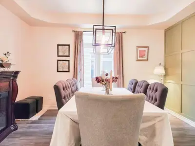 a dining room with a table and chairs at Inspired Stay close to Niagara *4B & 2King Beds* in Thorold