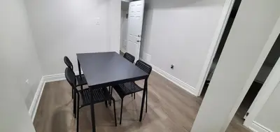 a black dining room table and chairs in a room at Cozy 2 Bedrooms & 2 Bathrooms Guest Suite with Electric Fireplace in Georgetown