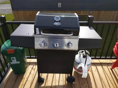 a grill sitting on top of a wooden deck at Subu's Paradise in Niagara in Niagara on the Lake