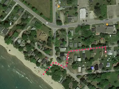 a map of a street with red lights next to the ocean at All Season Cottage close to Long Beach in Wainfleet