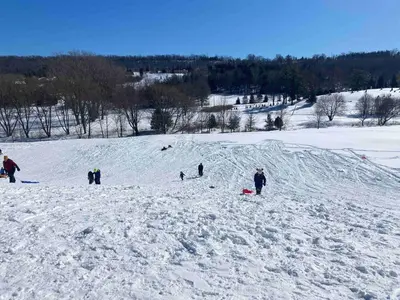 a group of people standing on a snow covered slope at Artistic Picton getaway in Picton