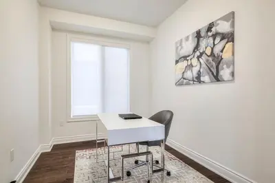 a white desk in a room with a window at The Ultimate Staycation in Bradford