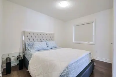 a bedroom with a large bed and a window at Relax, Refresh and Recharge Peaceful Space in Bradford