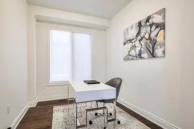 a white desk in a room with a window at Unwind Here in a Stylish and Cozy Space in Bradford