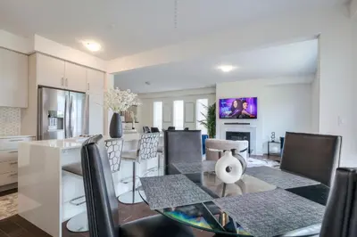 a kitchen and dining room with a table and chairs at Unwind Here in a Stylish and Cozy Space in Bradford