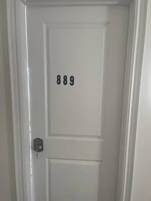 a door with a number on it in a room at Unwind Here in a Stylish and Cozy Space in Bradford