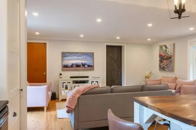a living room with a couch and a table at Elegant Elora Home with Stylish Décor in Elora