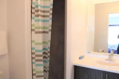 a bathroom with a sink and a shower at Modern Town House Barrie South in Barrie
