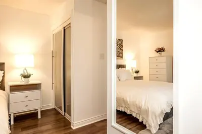 a bedroom with a large mirror and a bed at Mountainside Studio Bliss Pool, Hot Tubs, At the Mountain in Blue Mountains