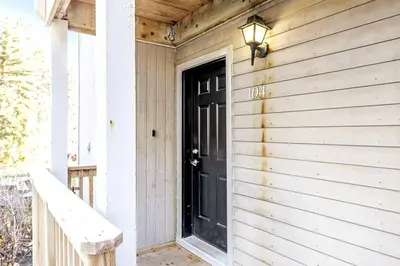 a black door on the side of a house at Mountainside Studio Bliss Pool, Hot Tubs, At the Mountain in Blue Mountains