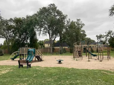 a park with a playground with a slide at Falcon Cottages in Niagara on the Lake